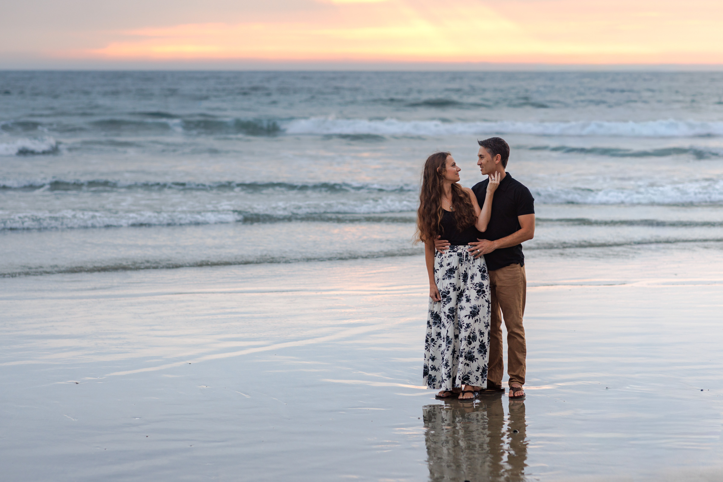 Couple at the water line during a Carlsbad session on the San Diego coast