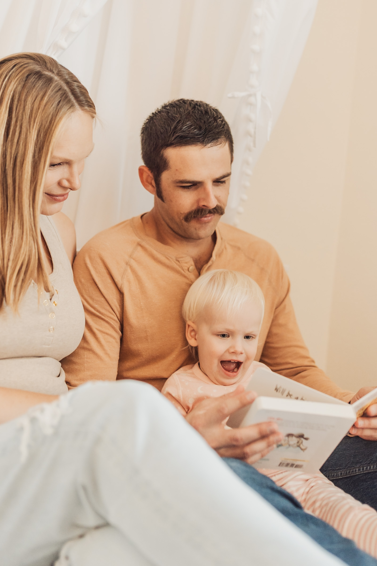 Parents at home with their baby during a relaxed newborn session