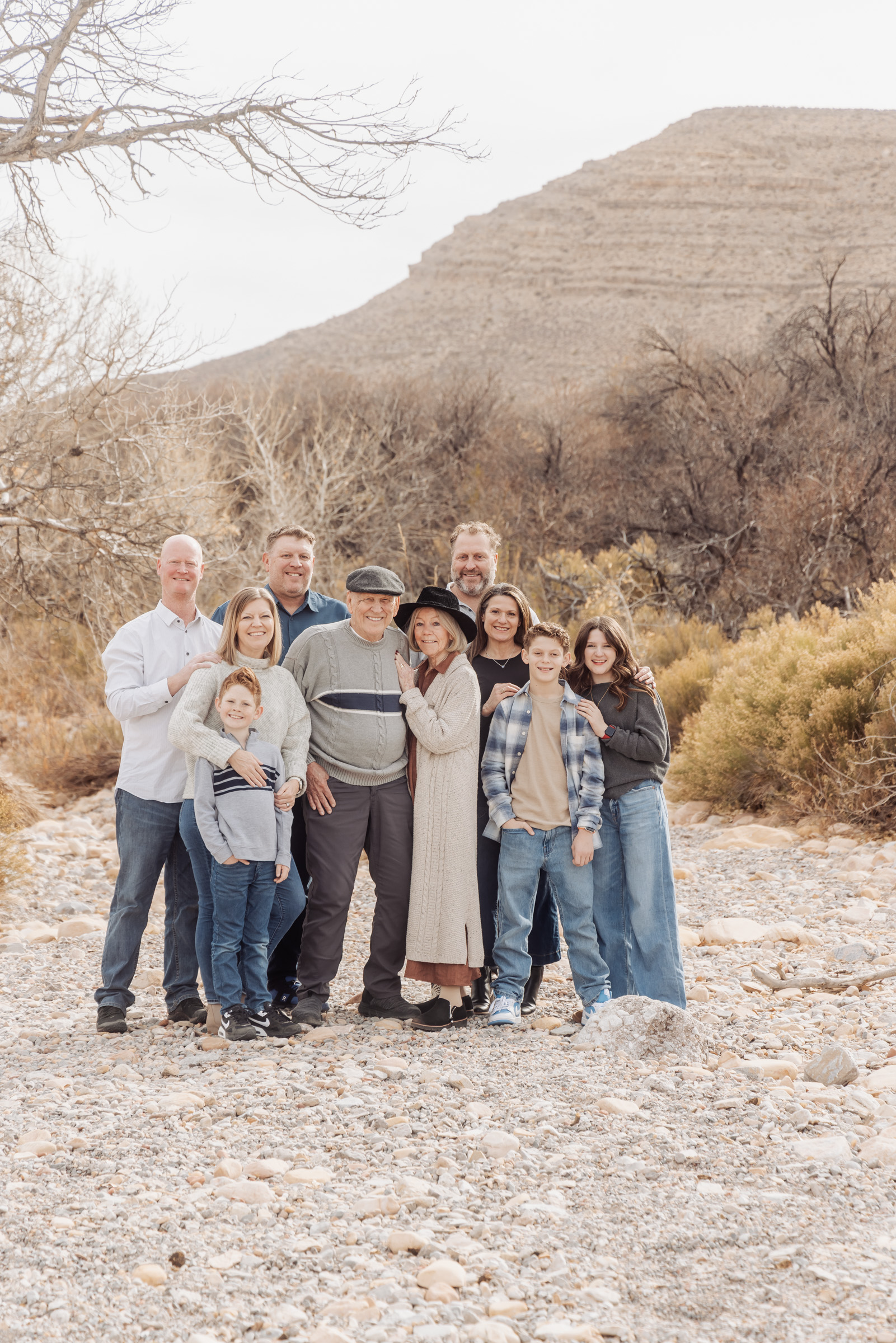 Extended family standing together in the desert brush at Red Rock Canyon, Las Vegas