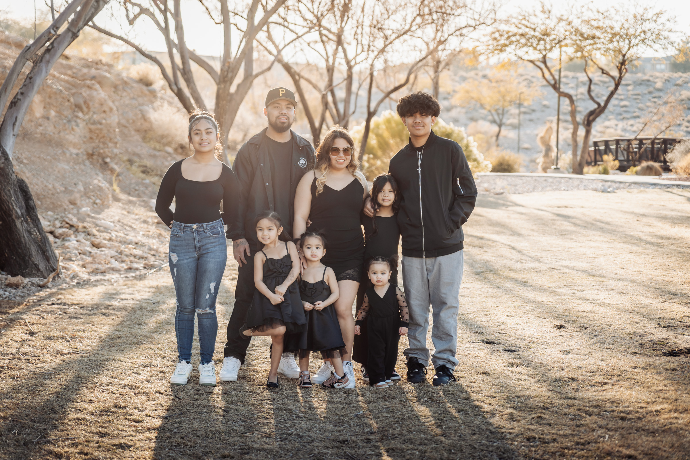 Parents and kids walking together and interacting during a Summerlin family session
