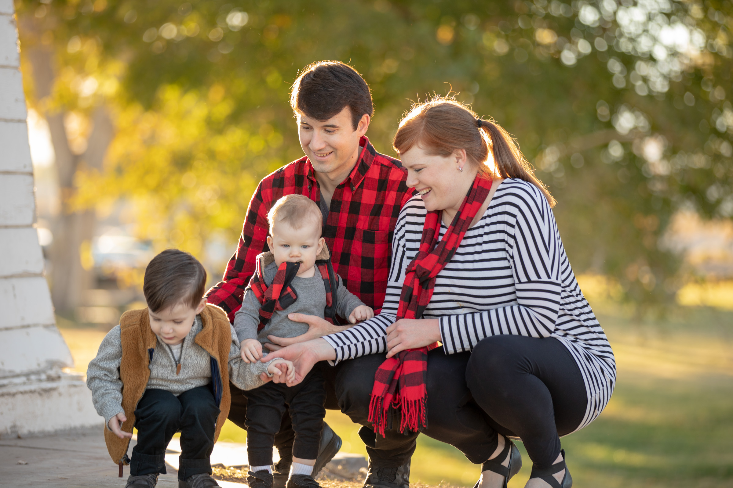 Family photographed together on the lawn at Floyd Lamb Park in Centennial Hills, Las Vegas