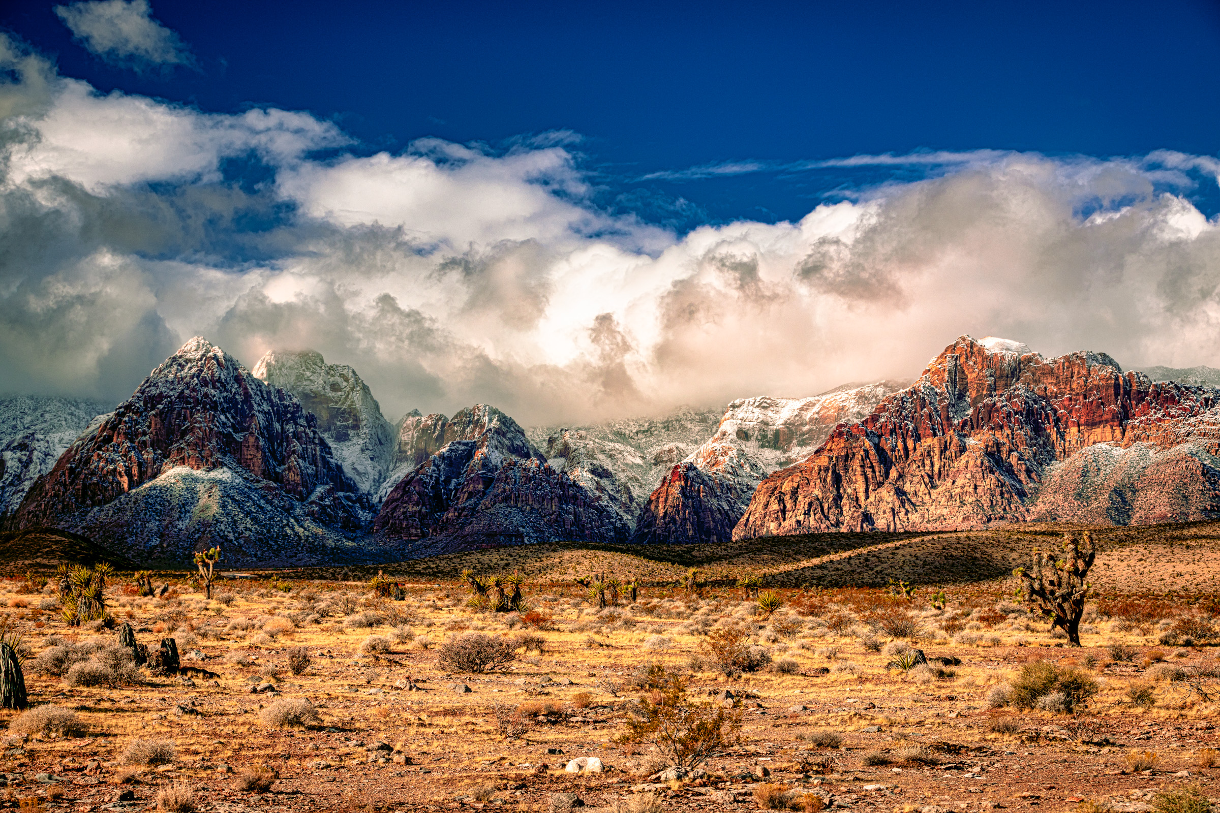 Red Rock Canyon escarpment lit by late afternoon sun outside Las Vegas