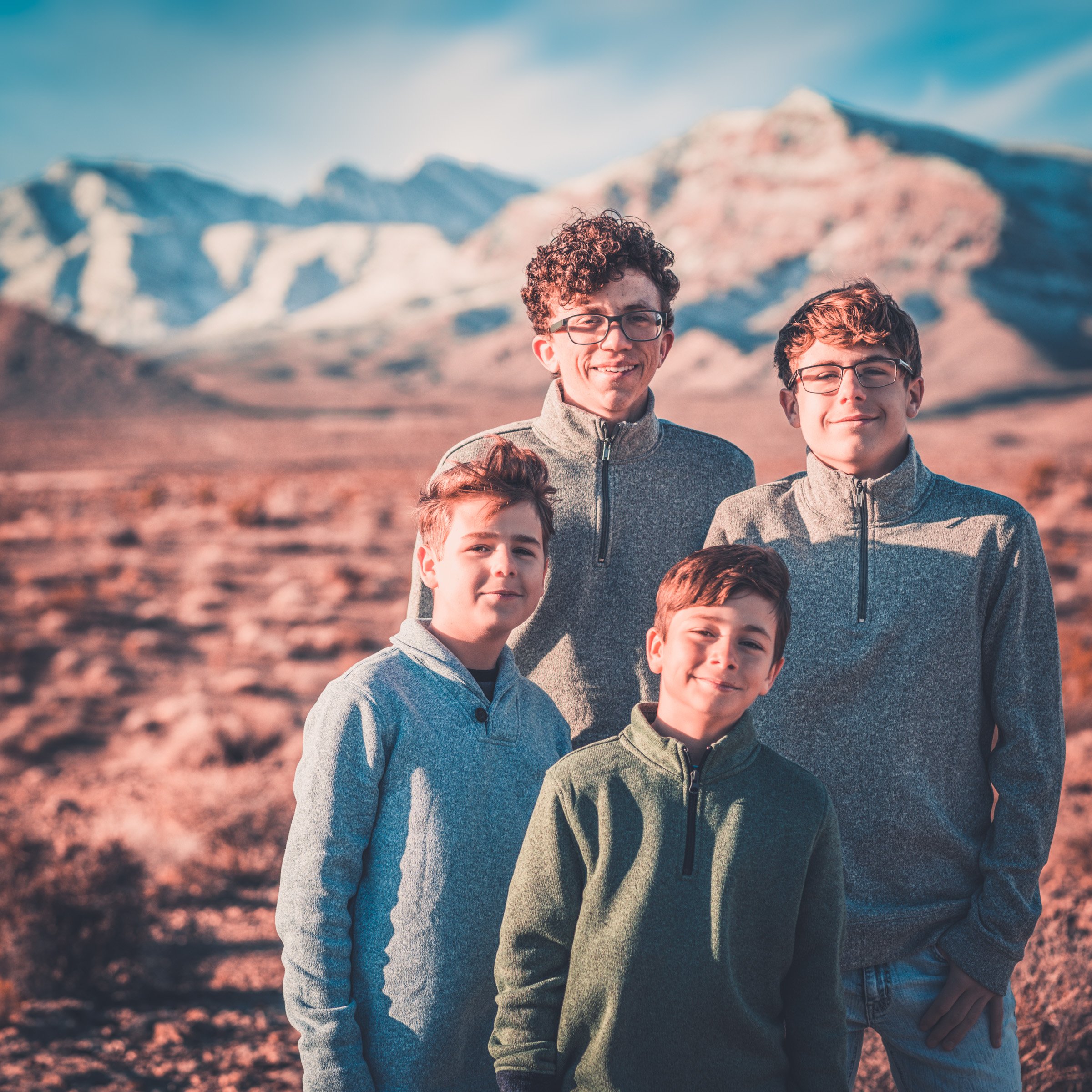 Family walking together along a mountain trail in Kyle Canyon