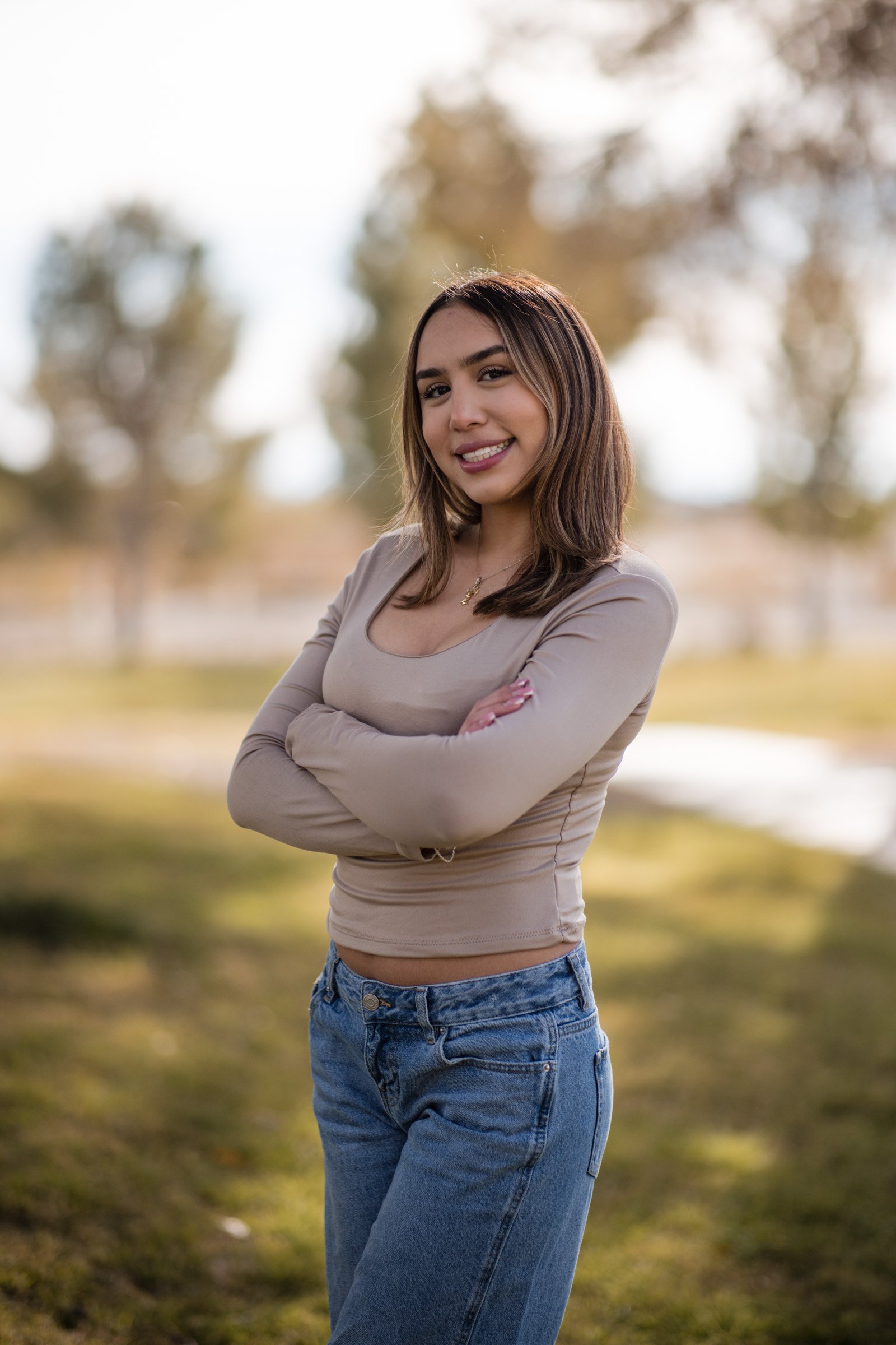 Senior portrait of a young woman in golden autumn light in Centennial Hills