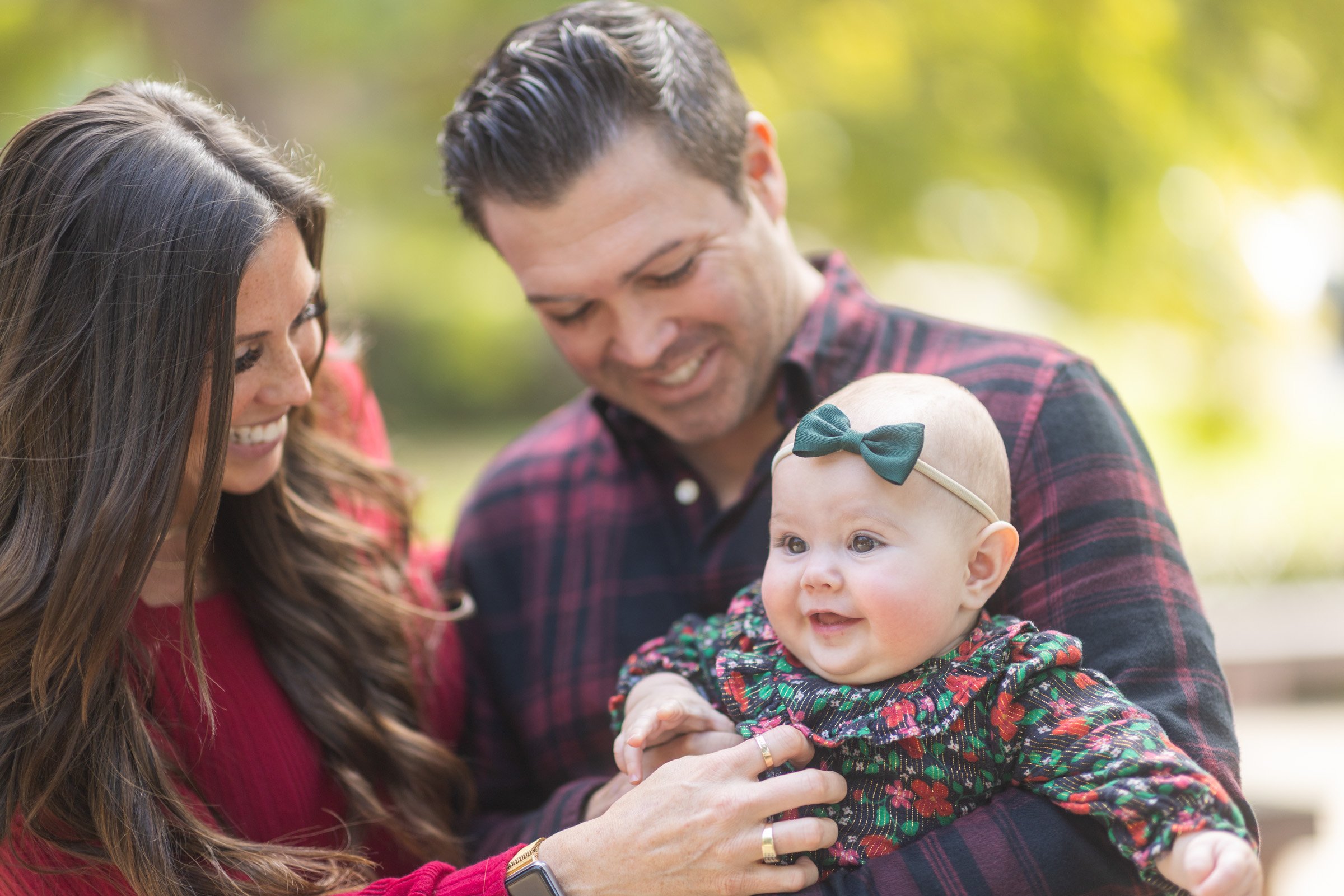 Parents holding their baby during a family photo session in Old Town San Diego