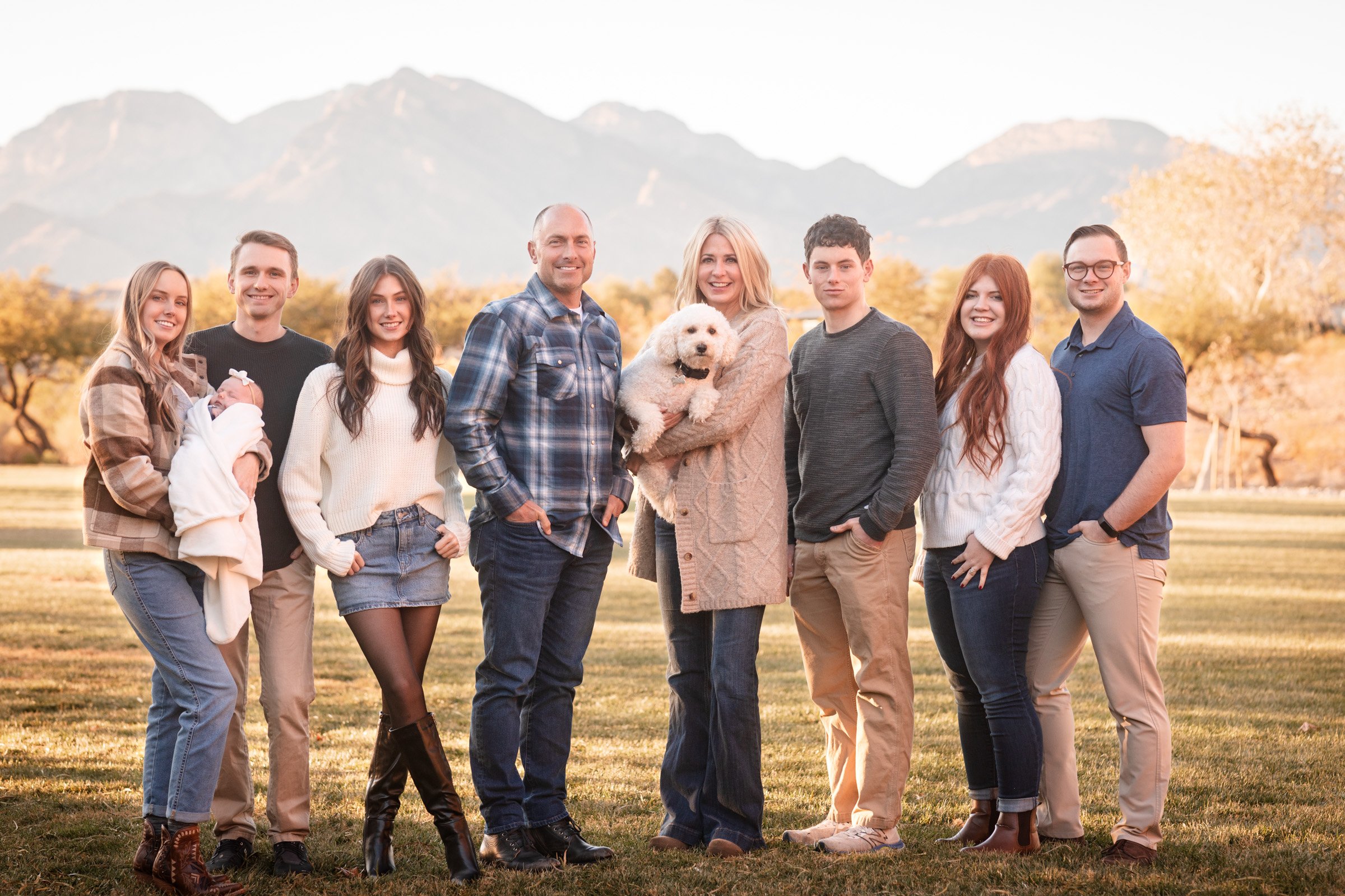 Large family photographed at golden hour in Summerlin, Las Vegas, with the Spring Mountains behind them