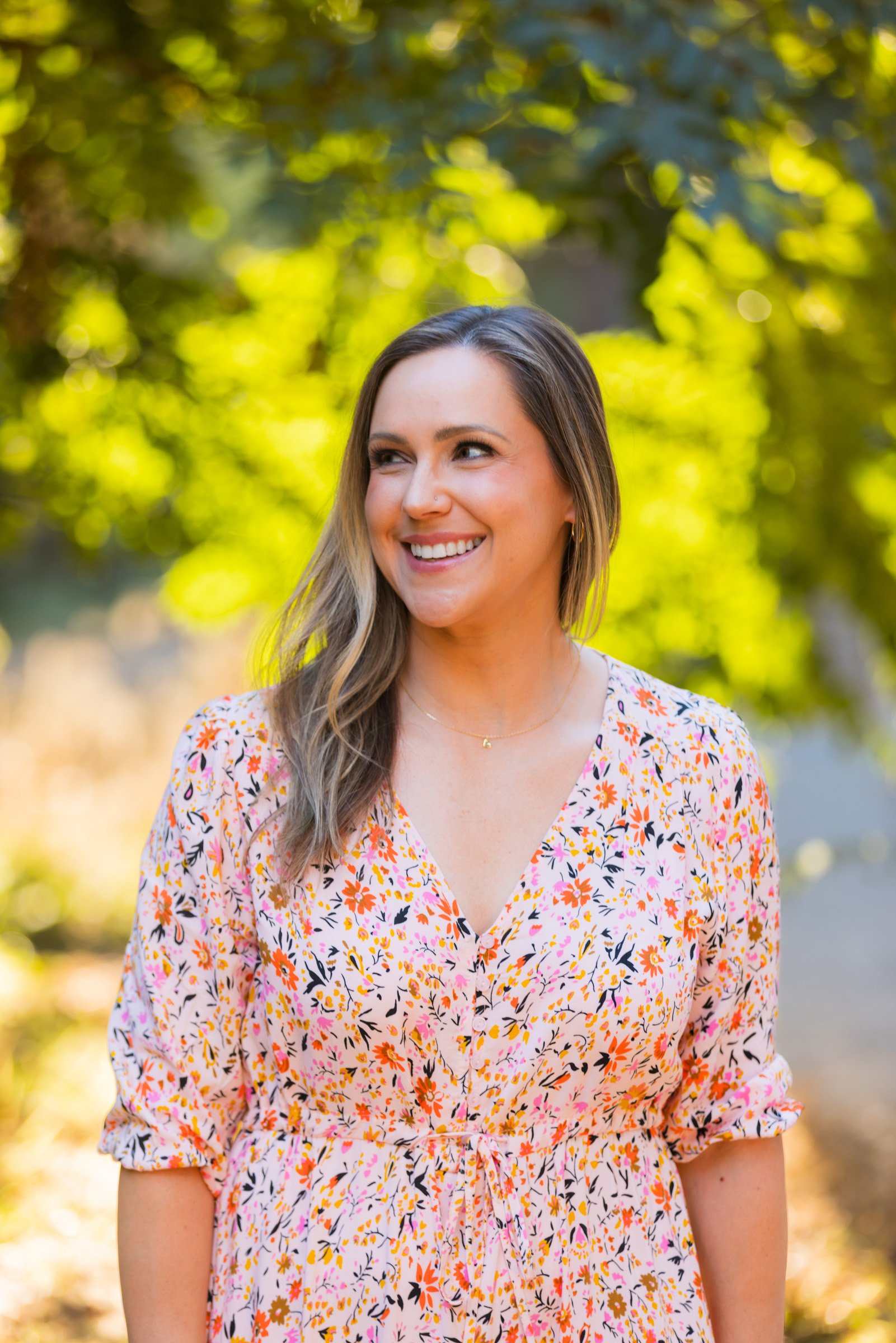 Portrait of a woman in golden light under the trees at Balboa Park, San Diego