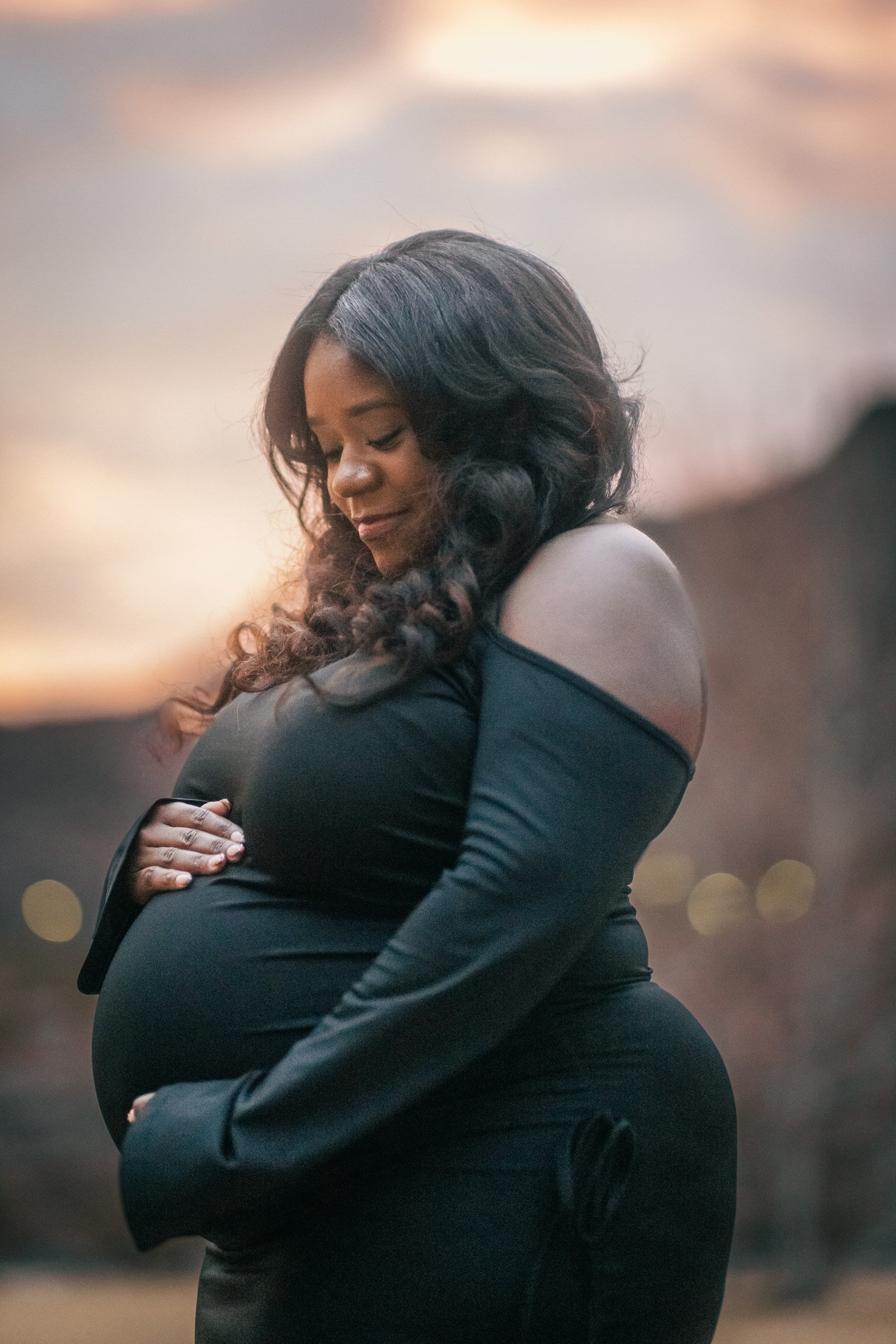 Expecting mother photographed at sunset during a Henderson maternity session