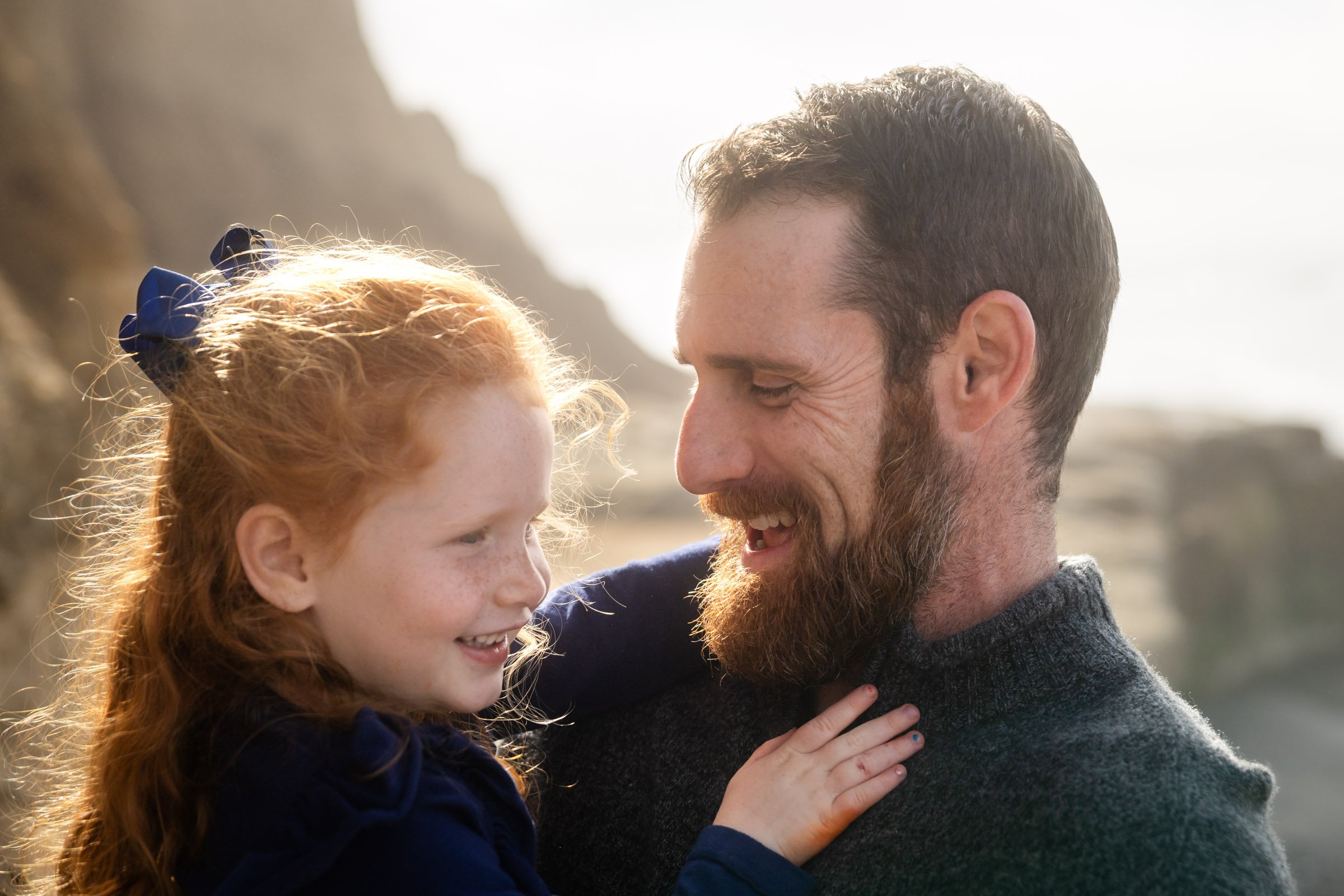 Las Vegas family photographer, father and daughter laughing outdoors