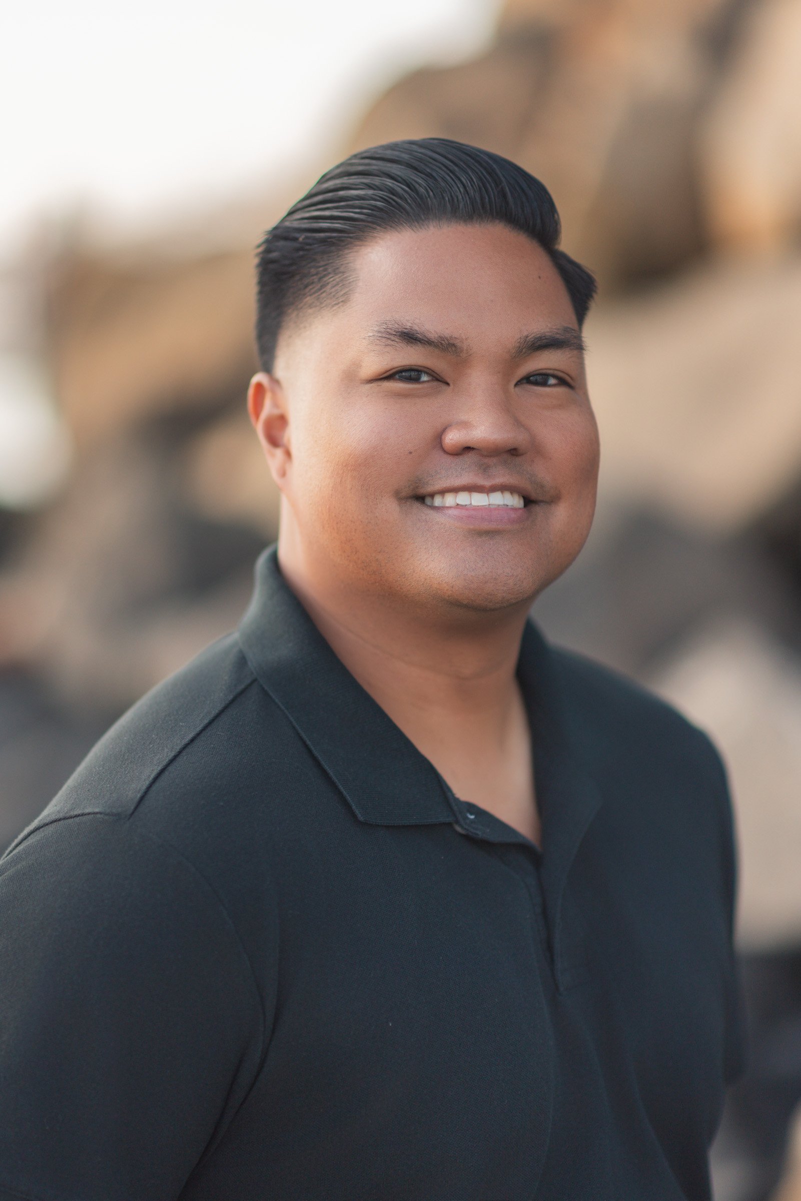 Outdoor professional headshot photographed on the beach in Oceanside, California